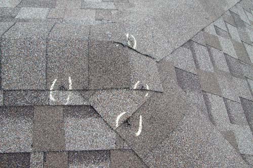 White house with shingle roof